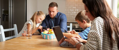 A family using devices at home