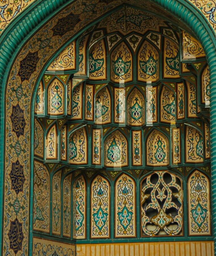 A highly decorative archway in a mosque in Tehran