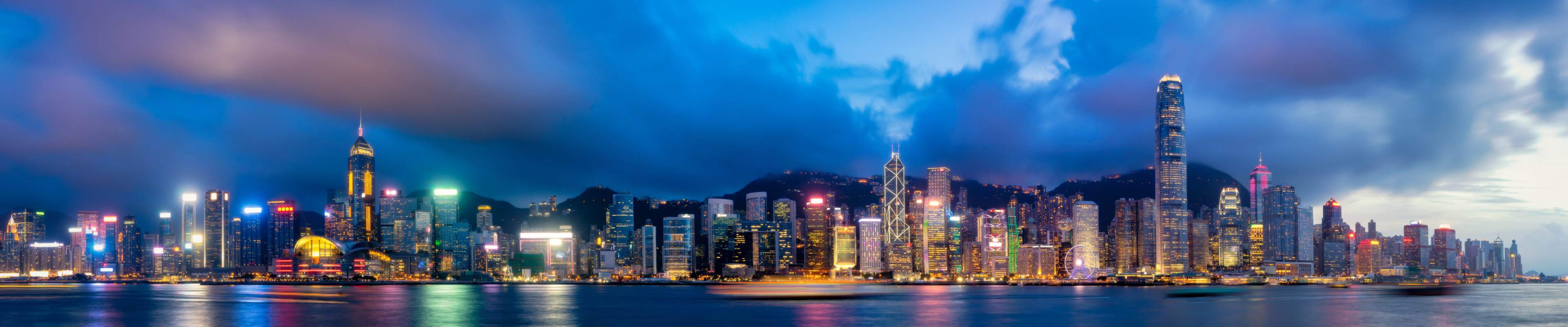 Panorama of Hong Kong City skyline at night. View from across Victoria Harbor Hongkong